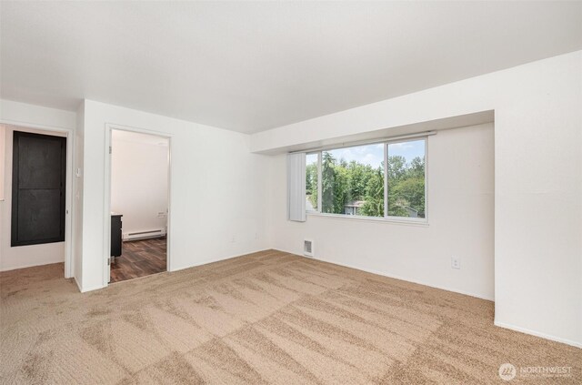 31308 107th Pl SE Unit B1, Auburn, WA 98092 - unfurnished bedroom featuring carpet flooring, a baseboard heating unit, and ensuite bathroom