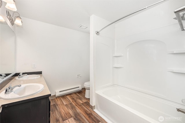 31308 107th Pl SE Unit B1, Auburn, WA 98092 - full bathroom with baseboard heating, double vanity, tub / shower combination, and wood finished floors