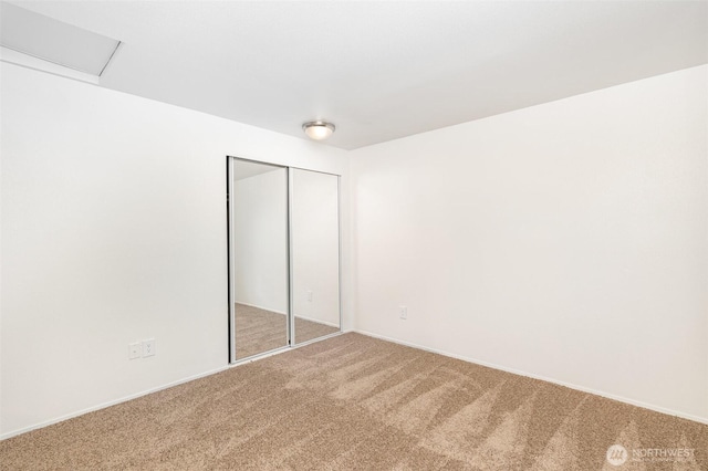 31308 107th Pl SE Unit B1, Auburn, WA 98092 - unfurnished bedroom featuring carpet flooring and a closet