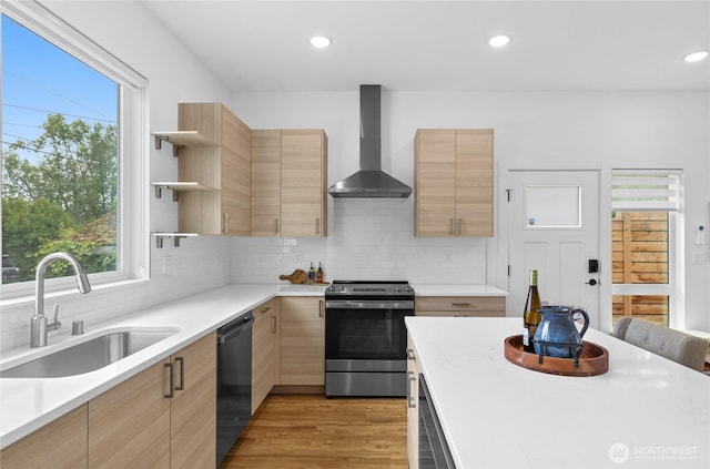 9228 21st Ave SW, Seattle, WA 98106 - kitchen featuring appliances with stainless steel finishes, wall chimney exhaust hood, light brown cabinetry, open shelves, and recessed lighting