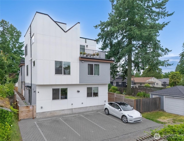 9228 21st Ave SW, Seattle, WA 98106 - back of property featuring uncovered parking and a balcony