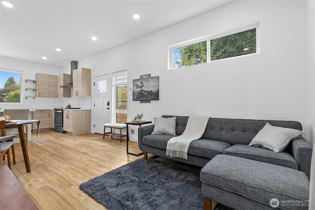 9228 21st Ave SW, Seattle, WA 98106 - living area with plenty of natural light, light wood finished floors, and recessed lighting