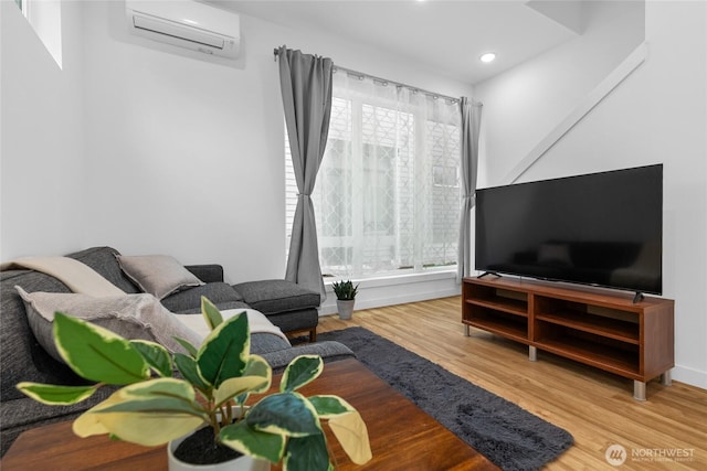 9228 21st Ave SW, Seattle, WA 98106 - living room with an AC wall unit, wood finished floors, and recessed lighting