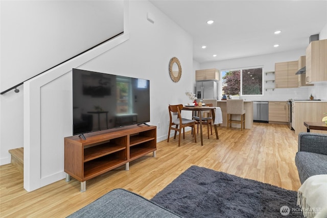 9228 21st Ave SW, Seattle, WA 98106 - living area with light wood-style floors, recessed lighting, and stairs