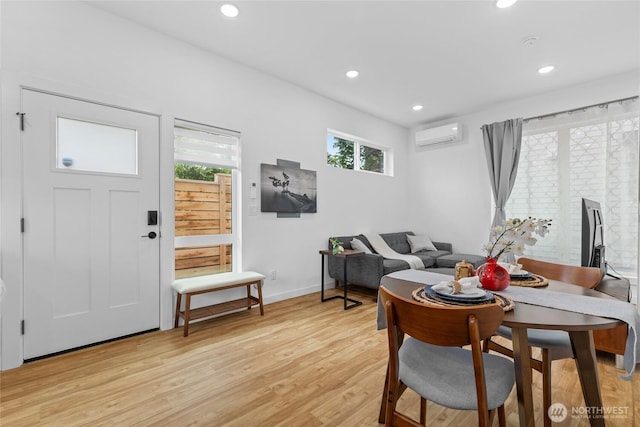 9228 21st Ave SW, Seattle, WA 98106 - dining space with light wood-style floors, recessed lighting, and a wall unit AC