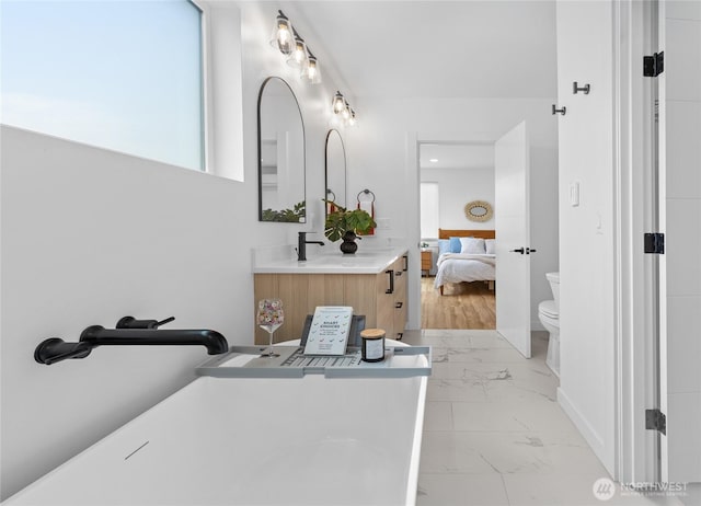 9228 21st Ave SW, Seattle, WA 98106 - ensuite bathroom featuring marble finish floors and vanity