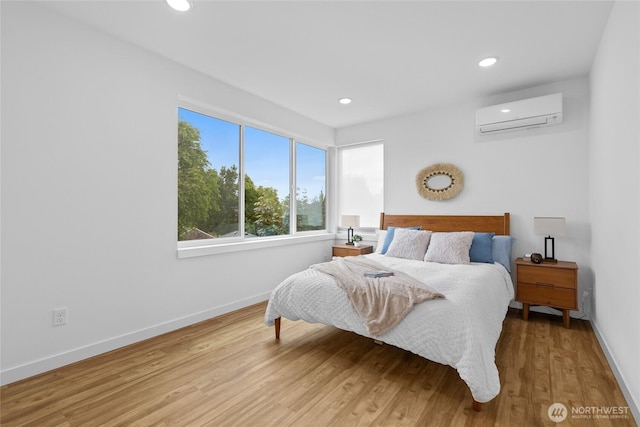 9228 21st Ave SW, Seattle, WA 98106 - bedroom featuring a wall mounted air conditioner, wood finished floors, and recessed lighting