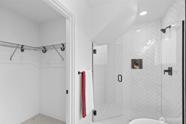 9228 21st Ave SW, Seattle, WA 98106 - full bath with a walk in closet, a shower stall, and marble look tiles