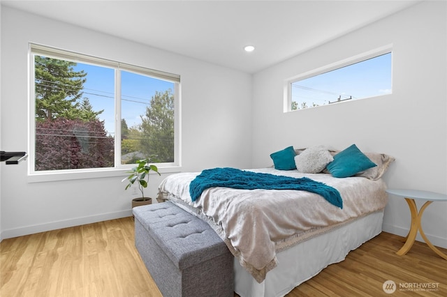 9228 21st Ave SW, Seattle, WA 98106 - bedroom with multiple windows, light wood-type flooring, and recessed lighting