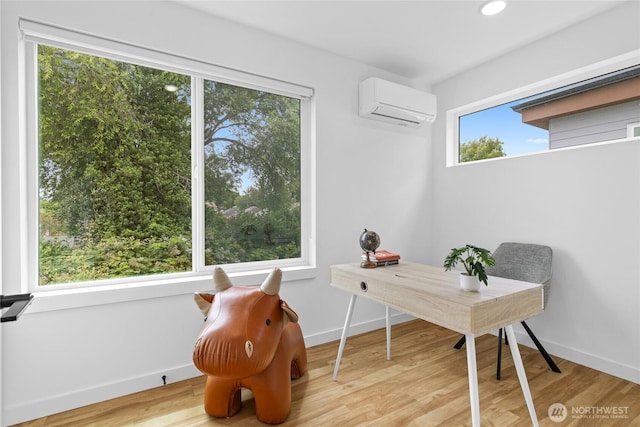 9228 21st Ave SW, Seattle, WA 98106 - office featuring an AC wall unit, wood finished floors, and recessed lighting
