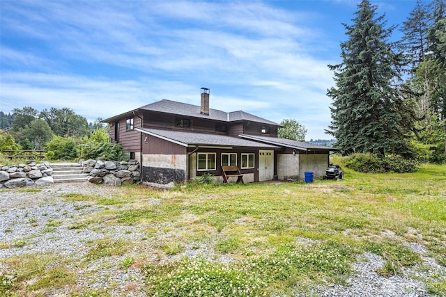 13402 Spring Site Rd E, Orting, WA 98360 - back of house with a chimney and a shingled roof