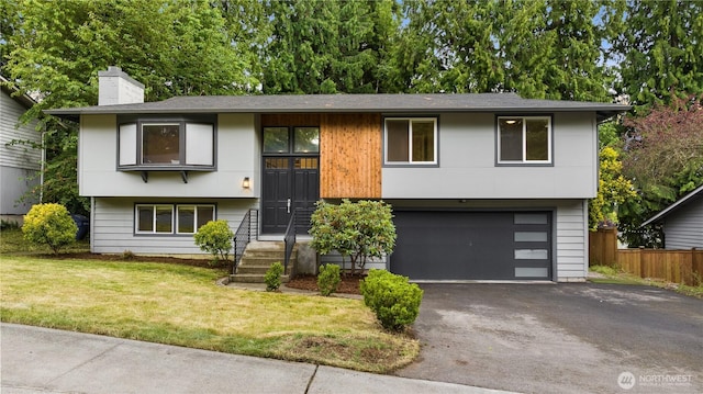 11335 NE 149th St, Kirkland, WA 98034 - raised ranch featuring a garage, driveway, and a chimney