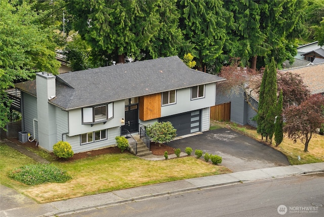 11335 NE 149th St, Kirkland, WA 98034 - view of front of house featuring roof with shingles, driveway, a chimney, and an attached garage