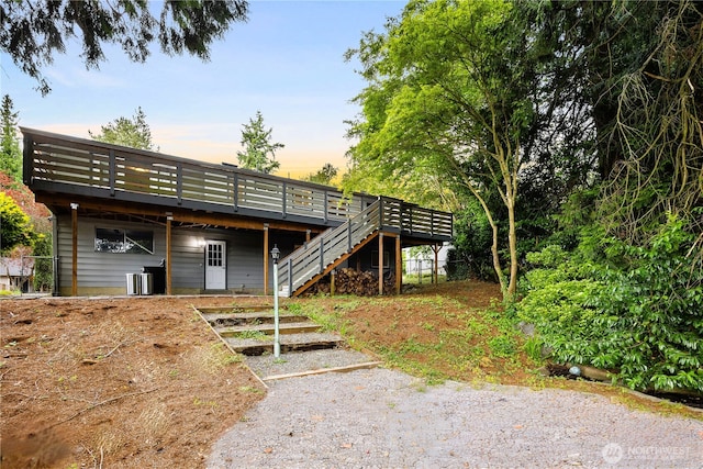 11335 NE 149th St, Kirkland, WA 98034 - back of house at dusk with a deck and stairs