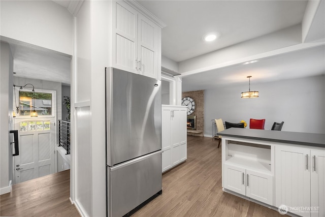 11335 NE 149th St, Kirkland, WA 98034 - kitchen featuring freestanding refrigerator, white cabinetry, light wood-style floors, and recessed lighting