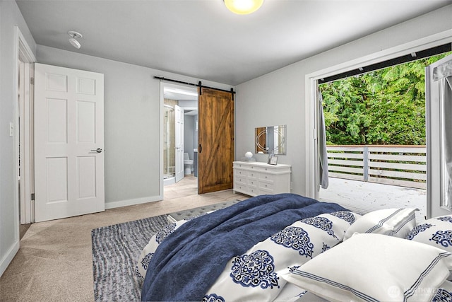 11335 NE 149th St, Kirkland, WA 98034 - carpeted bedroom featuring a barn door and ensuite bath