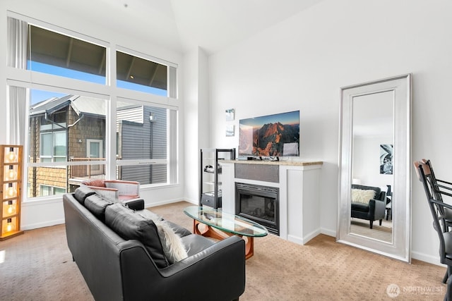 225 Logan Ave S Unit B355, Renton, WA 98057 - living area featuring carpet floors, a glass covered fireplace, and high vaulted ceiling