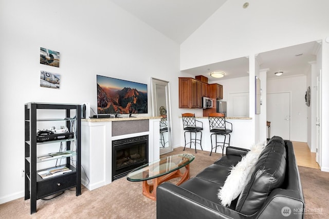 225 Logan Ave S Unit B355, Renton, WA 98057 - living room featuring a glass covered fireplace, light colored carpet, and high vaulted ceiling