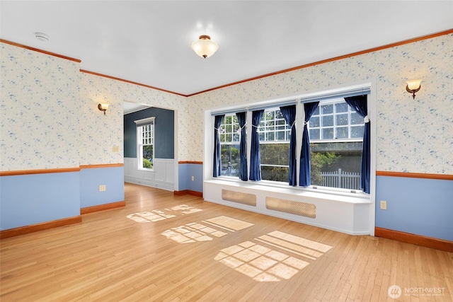 3402 N 28th St, Tacoma, WA 98407 - spare room featuring wallpapered walls, crown molding, hardwood / wood-style floors, wainscoting, and a smoke detector