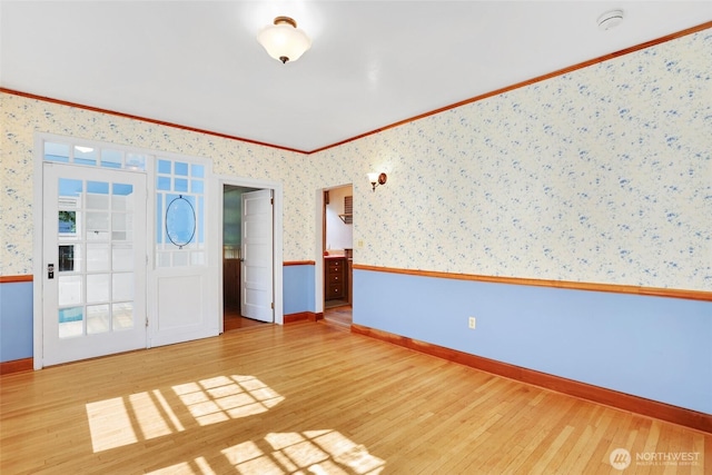 3402 N 28th St, Tacoma, WA 98407 - empty room with wallpapered walls, wood finished floors, a smoke detector, a wainscoted wall, and crown molding