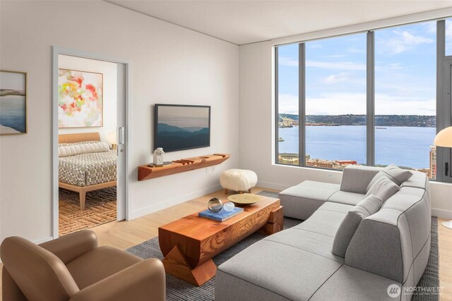 2510 6th Ave Unit 3605, Seattle, WA 98121 - living area featuring wood finished floors and a water view