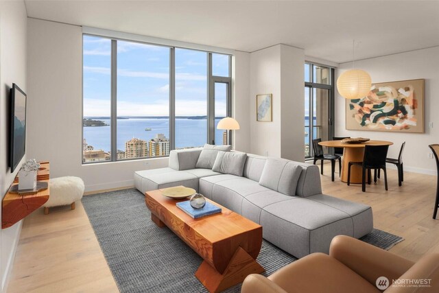 2510 6th Ave Unit 3605, Seattle, WA 98121 - living room with light wood finished floors and expansive windows