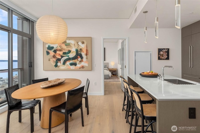 2510 6th Ave Unit 3605, Seattle, WA 98121 - dining space with healthy amount of natural light and light wood-style flooring