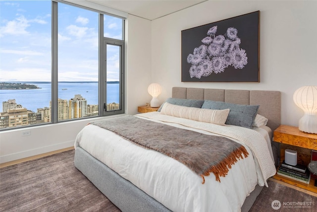 2510 6th Ave Unit 3605, Seattle, WA 98121 - bedroom featuring a water view and wood finished floors