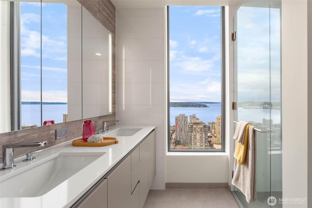 2510 6th Ave Unit 3605, Seattle, WA 98121 - full bath with a water view, double vanity, and tile patterned floors