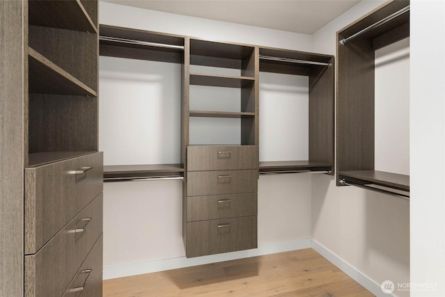 2510 6th Ave Unit 3605, Seattle, WA 98121 - walk in closet featuring light wood-type flooring