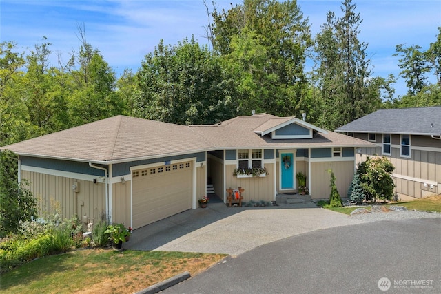 17356 Red Hawk Ct, Mount Vernon, WA 98274 - view of front of home featuring driveway, an attached garage, roof with shingles, and entry steps