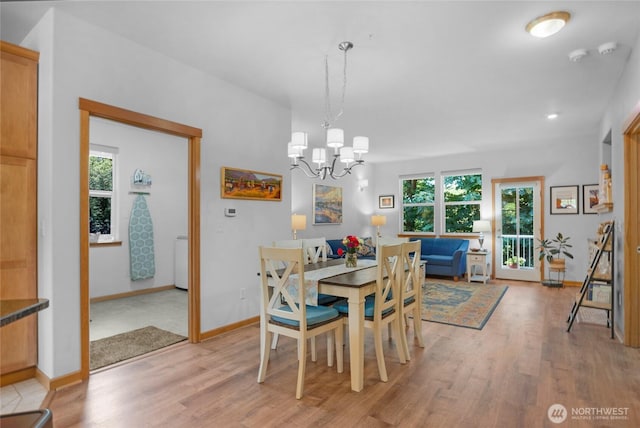 17356 Red Hawk Ct, Mount Vernon, WA 98274 - dining space with light wood finished floors, healthy amount of natural light, and a chandelier