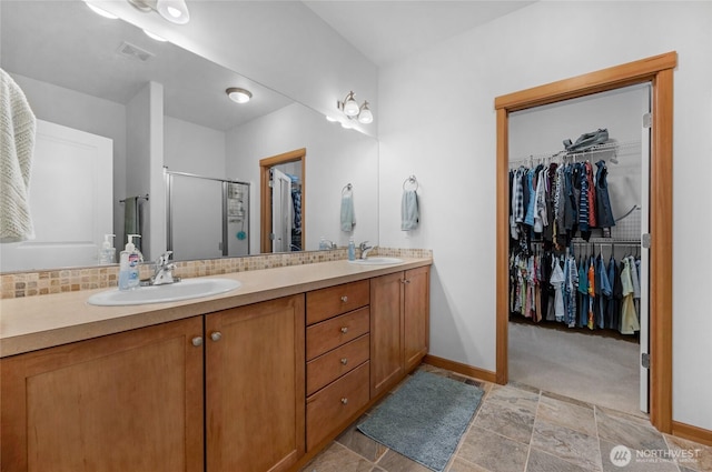 17356 Red Hawk Ct, Mount Vernon, WA 98274 - full bath with double vanity, a spacious closet, a stall shower, and stone finish flooring