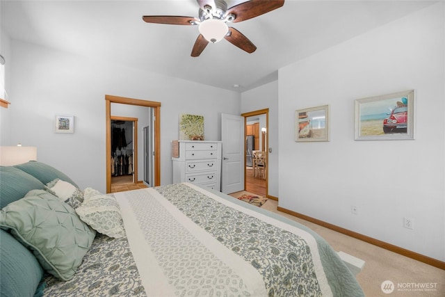 17356 Red Hawk Ct, Mount Vernon, WA 98274 - bedroom featuring a spacious closet, light carpet, and ceiling fan