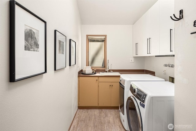 6160 W Mercer Way, Mercer Island, WA 98040 - laundry room with cabinet space, independent washer and dryer, and light wood finished floors