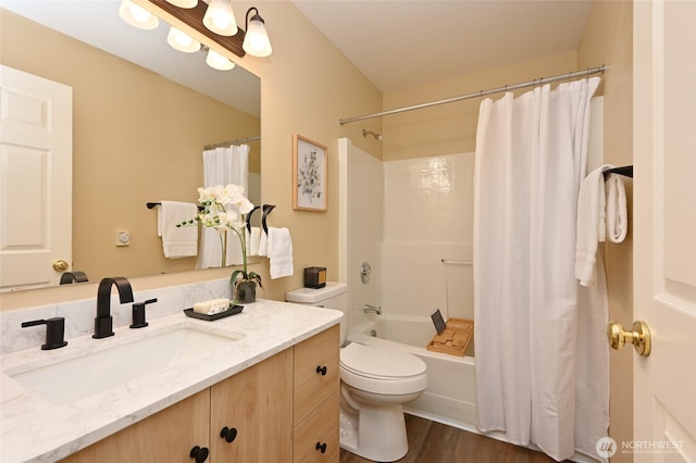 2001 120th Pl SE Unit 7-101, Everett, WA 98208 - full bathroom with vanity, shower / bath combo with shower curtain, and wood finished floors