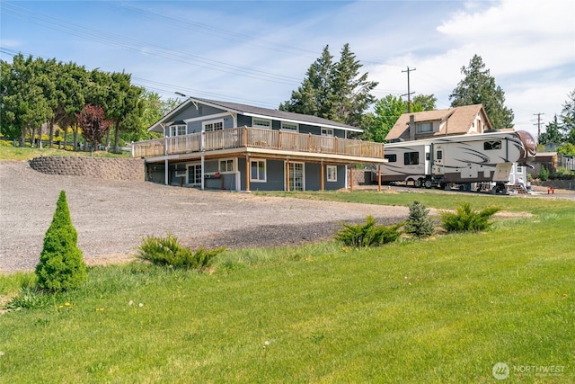 2440 Rock Island Rd, East Wenatchee, WA 98802 - rear view of property with a wooden deck, driveway, and a yard