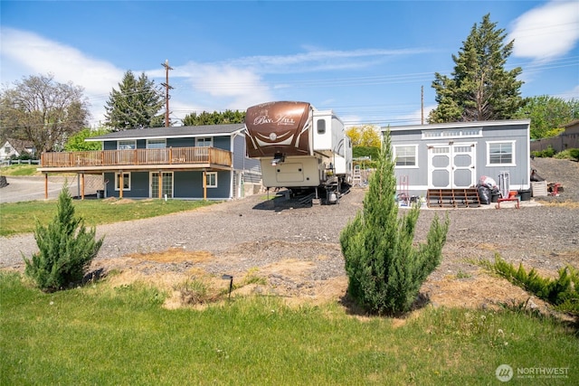 2440 Rock Island Rd, East Wenatchee, WA 98802 - rear view of house featuring a deck, an outbuilding, and driveway