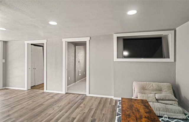 2440 Rock Island Rd, East Wenatchee, WA 98802 - sitting room with wood finished floors, a textured ceiling, and recessed lighting