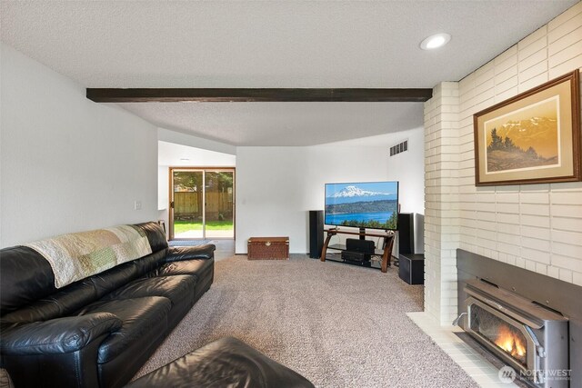 13222 76th Avenue Ct E, Puyallup, WA 98373 - living area with beamed ceiling, carpet floors, a textured ceiling, and a brick fireplace