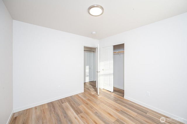 1325 Shaw St, Moses Lake, WA 98837 - unfurnished bedroom with light wood finished floors and a closet