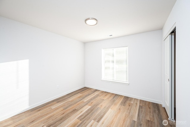 1325 Shaw St, Moses Lake, WA 98837 - unfurnished bedroom with wood finished floors and a closet