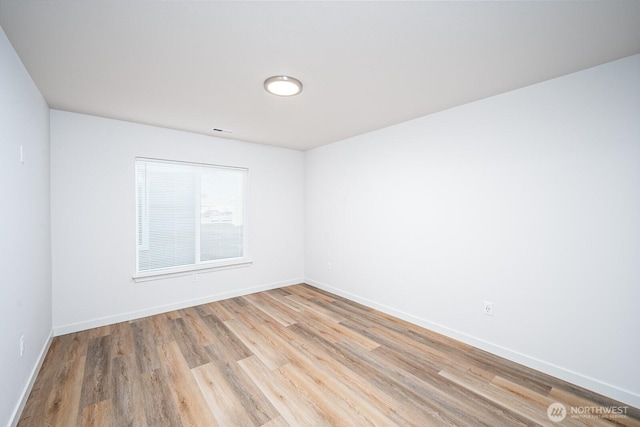 1325 Shaw St, Moses Lake, WA 98837 - unfurnished room with light wood finished floors and baseboards