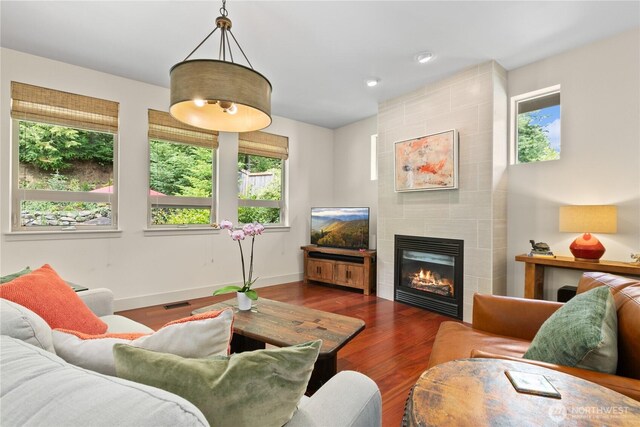 1129 Birch Falls Dr, Bellingham, WA 98229 - living area with a tile fireplace, wood finished floors, and recessed lighting