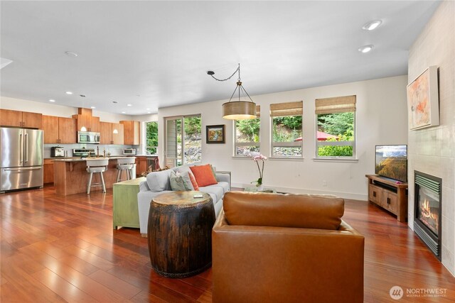 1129 Birch Falls Dr, Bellingham, WA 98229 - living room with dark wood-style floors, a tile fireplace, and recessed lighting