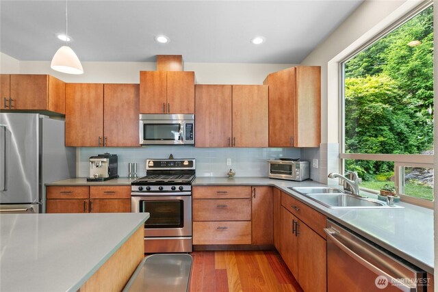 1129 Birch Falls Dr, Bellingham, WA 98229 - kitchen featuring stainless steel appliances, wood finished floors, backsplash, light countertops, and recessed lighting