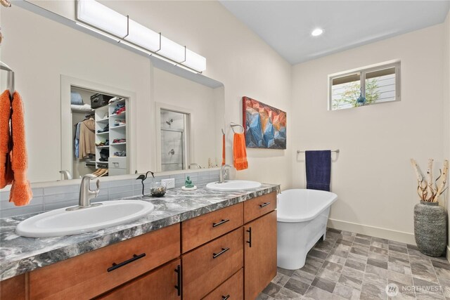 1129 Birch Falls Dr, Bellingham, WA 98229 - full bathroom with a shower stall, double vanity, a freestanding tub, a walk in closet, and recessed lighting