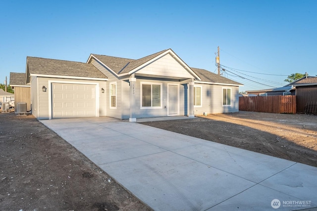 1420 W Craig St, Moses Lake, WA 98837 - single story home with an attached garage, concrete driveway, and a shingled roof