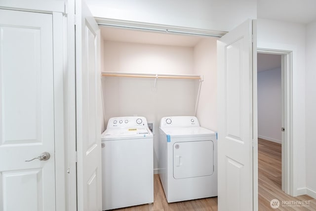 1420 W Craig St, Moses Lake, WA 98837 - washroom with washing machine and dryer and light wood-type flooring