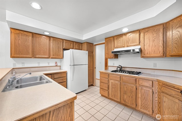 5788 Hannegan Rd, Bellingham, WA 98226 - kitchen with freestanding refrigerator, under cabinet range hood, stainless steel gas stovetop, recessed lighting, and light countertops